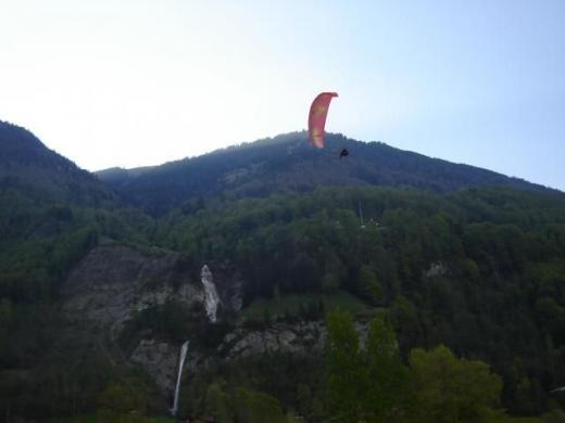 Paraglider over campsite